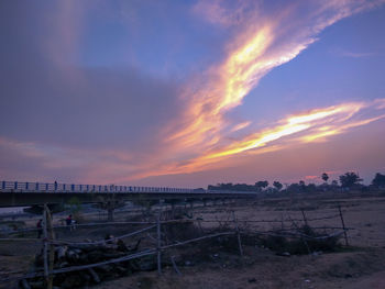 Scenic view of beach against sky during sunset