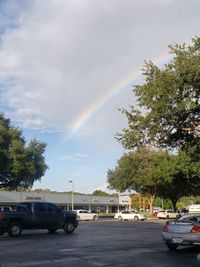 View of rainbow over city street