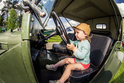 Boy sitting in car