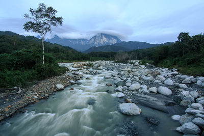 Scenic view of river stream against sky