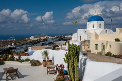 High angle view of townscape by sea against sky