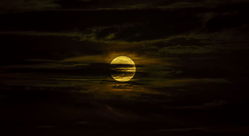 Close-up of moon against sky at sunset