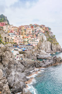 Panoramic view of beach and buildings against sky