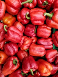 Full frame shot of red bell peppers at market stall