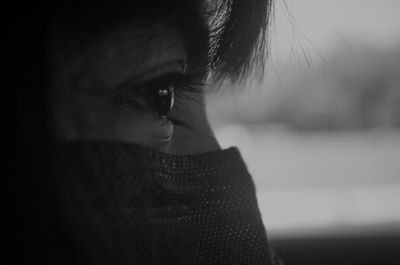 Close-up portrait of young woman looking away