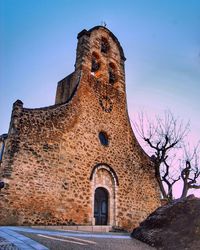 Low angle view of old building against sky