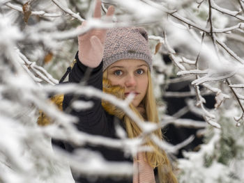 Portrait of young woman in snow