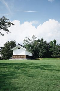 House on field against sky