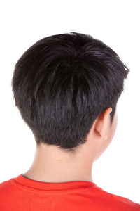 Rear view of boy against white background