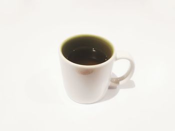 Close-up of coffee cup against white background