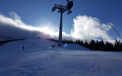 People skiing on snowcapped mountain