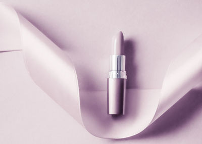 High angle view of lipstick against white background