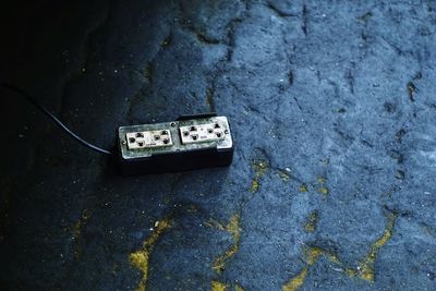 High angle view of old telephone on wall