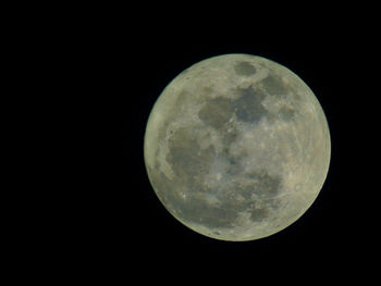 Low angle view of moon against clear sky at night