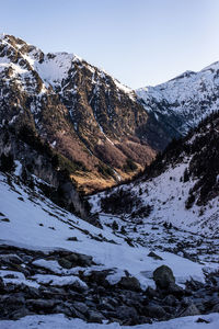 Scenic view of snowcapped mountains against clear sky