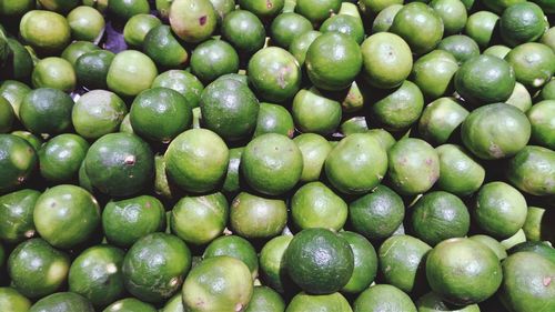 Full frame shot of limes for sale in market