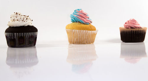 Close-up of cupcakes against white background