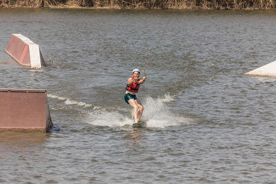 Man kite boarding in river