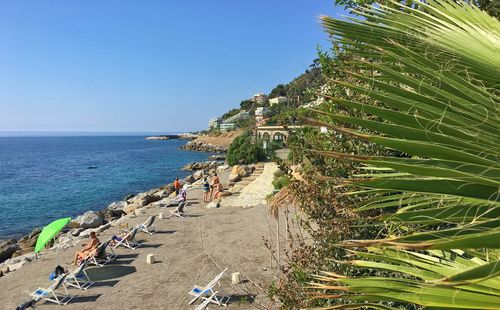 Scenic view of beach against blue sky