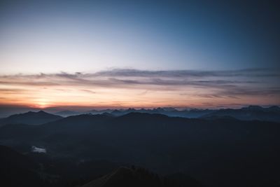 Scenic view of silhouette mountains against sky during sunset