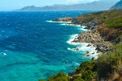 High angle view of sea and mountains