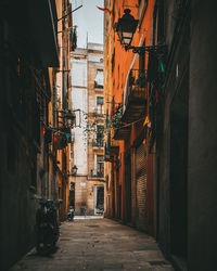 Narrow alley amidst buildings in city