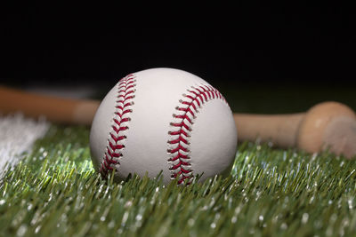 Close-up of baseball on field