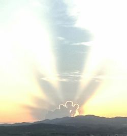 Scenic view of mountains against sky during sunset