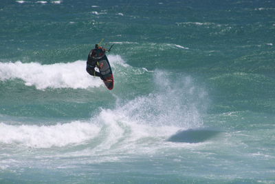 People surfing in sea