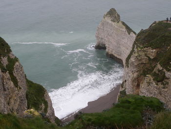 High angle view of rocks at sea shore