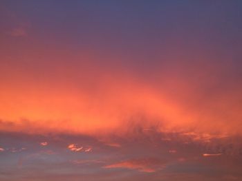 Low angle view of cloudy sky at sunset