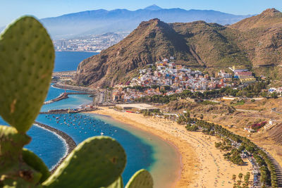 Panoramic view of sea and buildings against sky