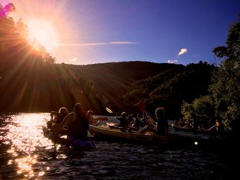 Sun shining over river