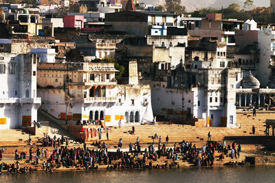 Pilgrims at pushkar lake on sunny day