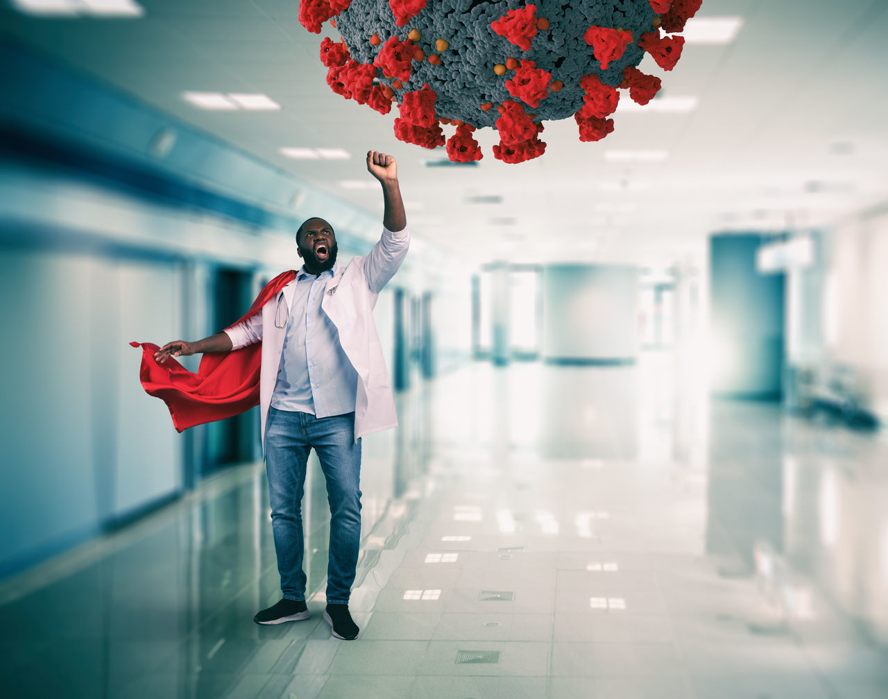 FULL LENGTH OF MAN STANDING WITH UMBRELLA IN BUILDING