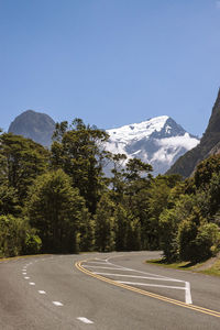 Scenic view of mountains against blue sky