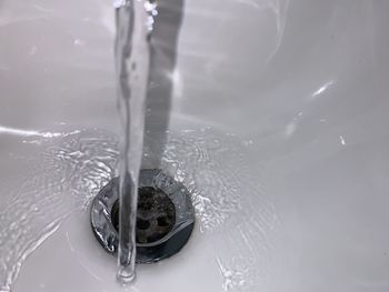 High angle view of water splashing in bathroom