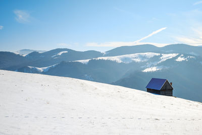 Sun over the winter mountains with snow, cindrel mountains, paltinis, romania