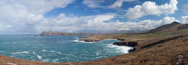 Scenic view of sea against cloudy sky