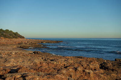 Scenic view of sea against clear sky