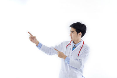 Full length of a man standing against white background