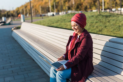 Portrait of young woman using mobile phone