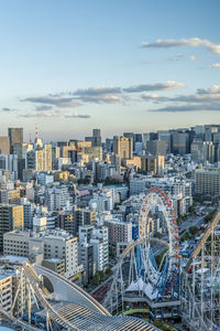 Aerial view of modern buildings in city against sky