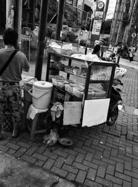 Rear view of man working on street