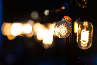 Close-up of illuminated light bulb