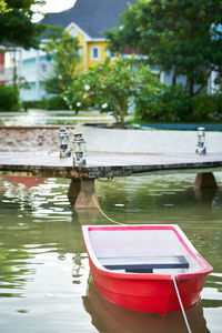 Red boat  on lake in the garden 