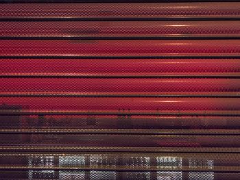 Full frame shot of illuminated red wall