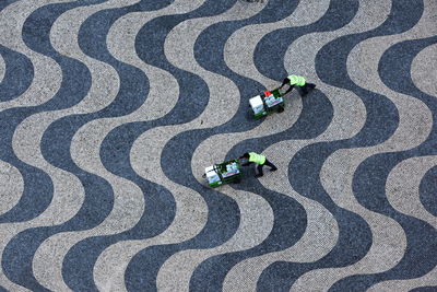 High angle view of two men cleaning floor