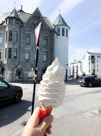 Hand holding ice cream cone