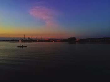 View of harbor at sunset